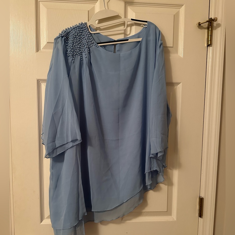 Light blue women’s pantsuit. Size 4xl. Never worn.